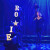 A leading female character stands in blue light alongside a series of light-up letters spelling the name 'Roxie' during a scene from Concordia's 2024 musical production