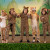 Five cast members in costume striking a pose in animal costumes while performing in their 2024 musical production